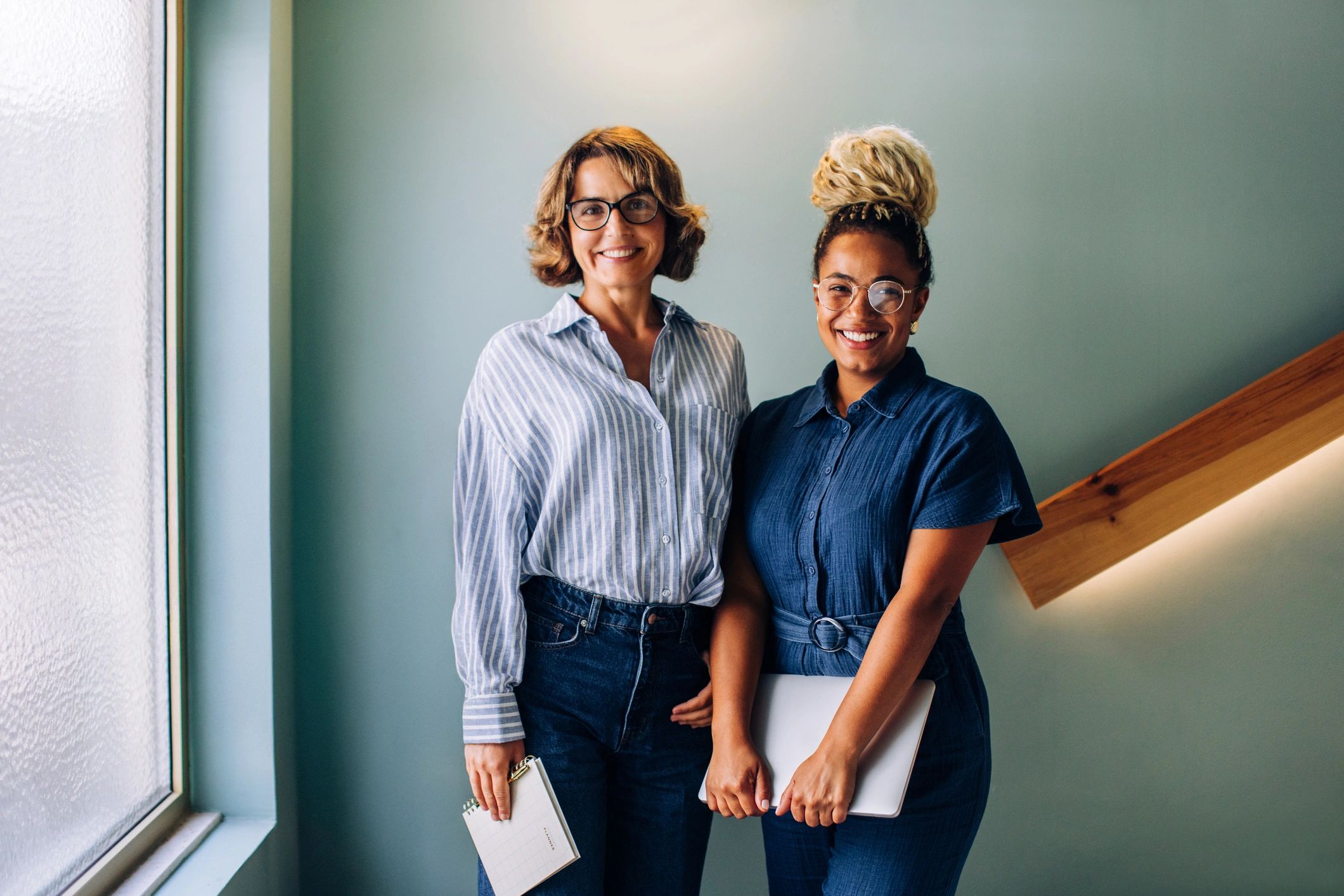 two women small business owners, upscale, elegant, smiling, modern background